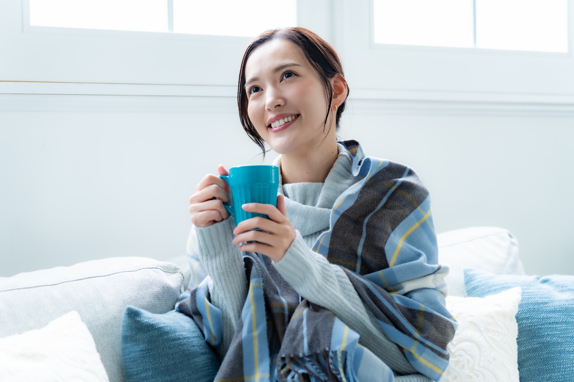 体が温まりリラックスした表情の女性